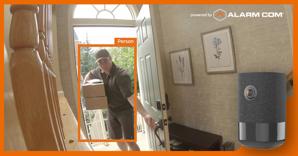 This image shows a home entryway with a smart home security camera interface. A delivery man is seen outside the front door carrying a package.