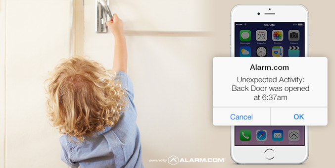 A child reaches for a door handle while a smartphone displays an alert from a security app noting unexpected activity at a door.