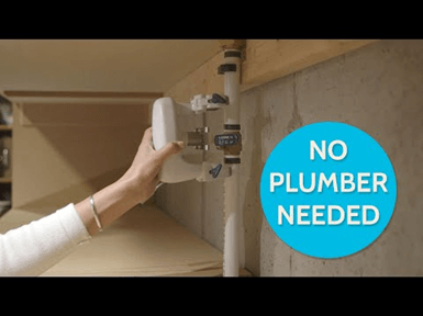 A person is attaching a device to pipes. Text "NO PLUMBER NEEDED" suggests ease of installation. The setting appears to be a utility space.