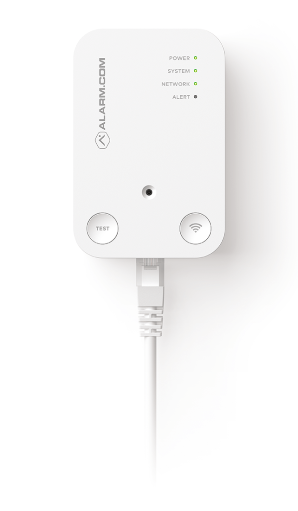 The image shows a white rectangular device labeled "ALARM.COM" with indicator lights, a test button, and a connected Ethernet cable against a white background.