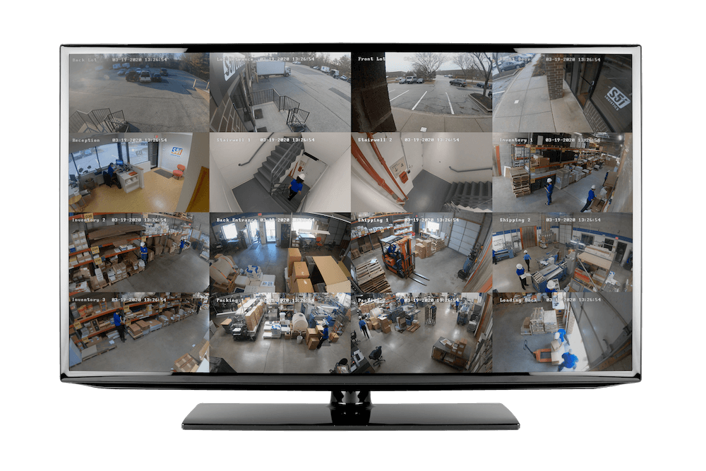 This image shows a computer monitor displaying multiple CCTV security camera feeds from different angles of a warehouse environment, with workers and merchandise visible.