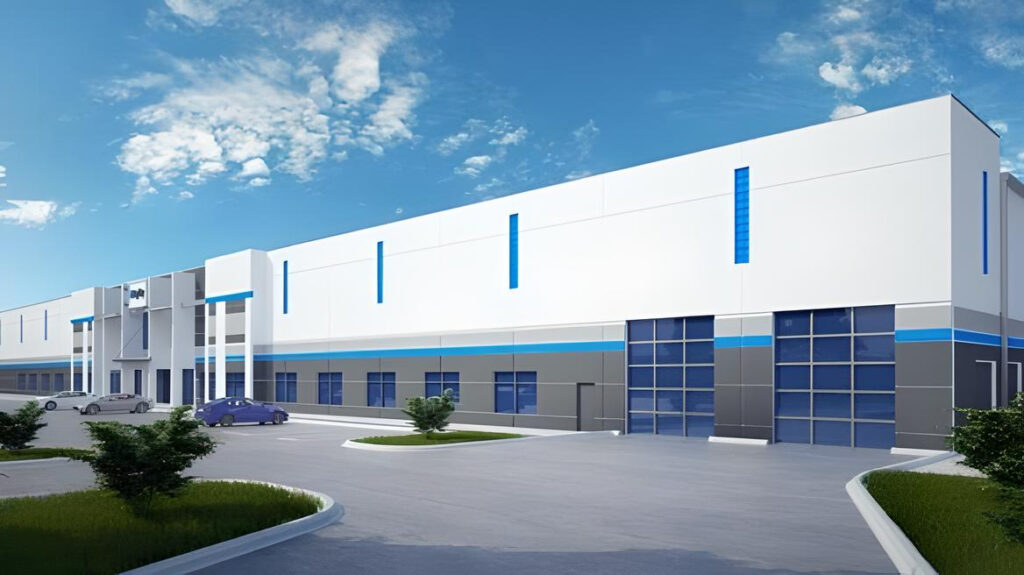 This is a digital rendering of a modern industrial warehouse with a white and blue exterior, large loading bays, a parking lot, and a clear blue sky.