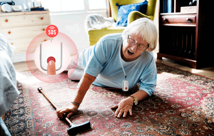 An elderly person has fallen on a carpet beside a walking stick, reaching out towards an emergency button, indicating a need for assistance.